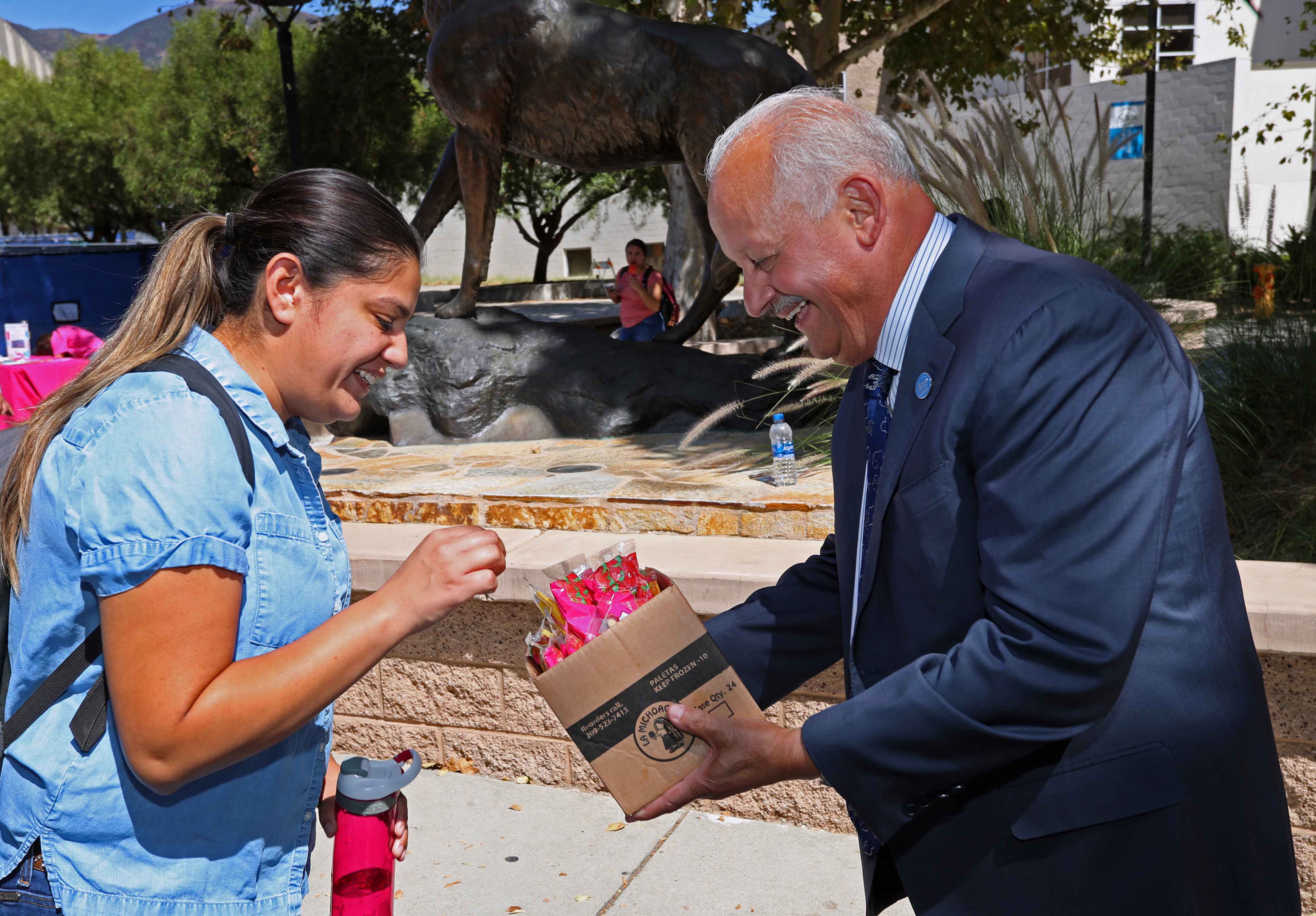 Cal State San Bernardino President Tomás D. Morales and the university’s Orientation and First Year Experience handed out popsicles to students near the Wild Song statue on Sept. 23.
