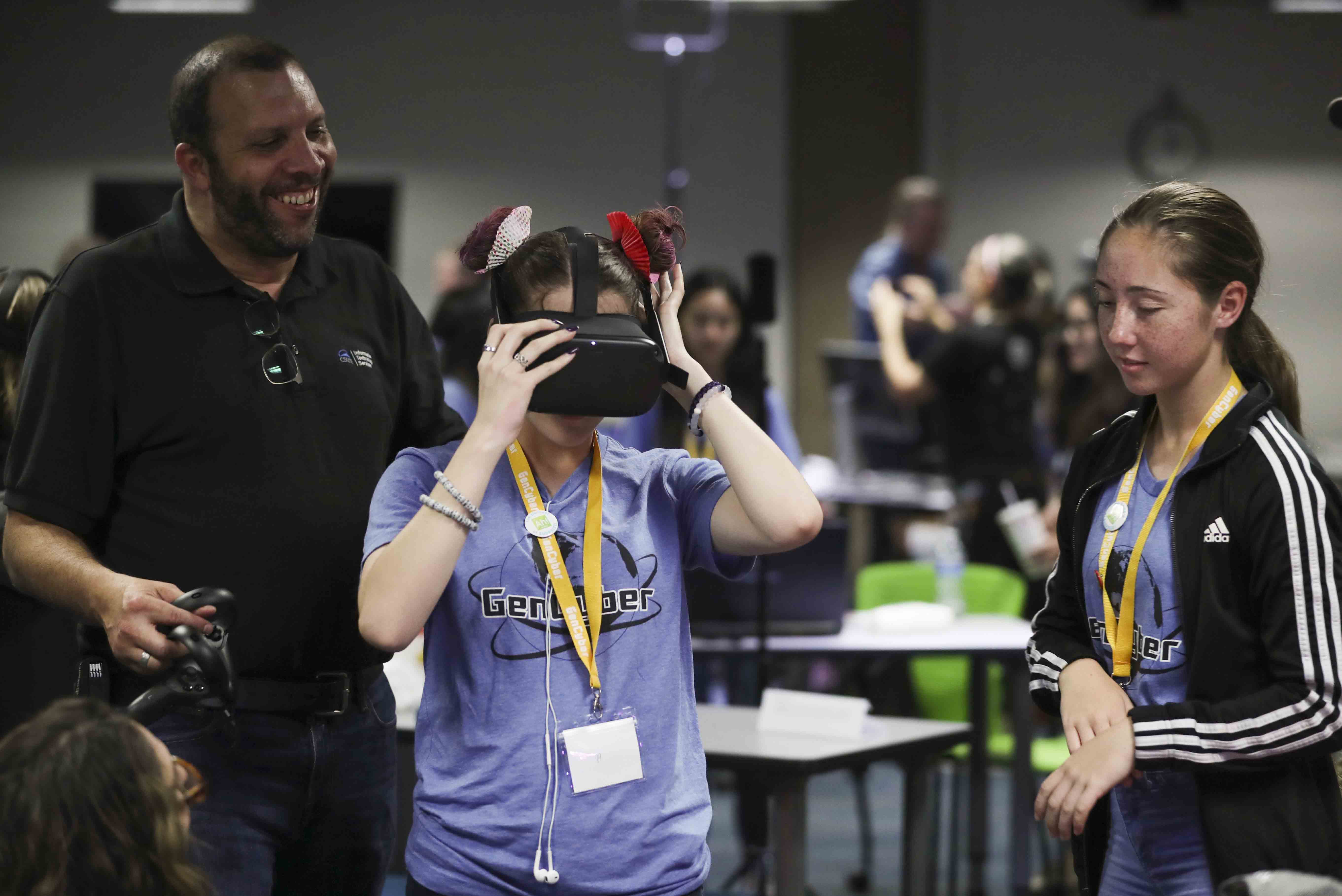 Checking out a virtual reality headset at GenCyber camp.